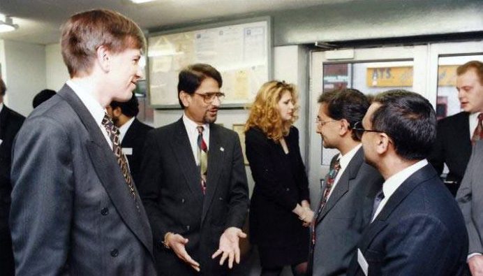Nazir Jessa is seen talking to the Directors of Swift Car Care at the presentation of the ISO 9002 Part2 Award by NQA.